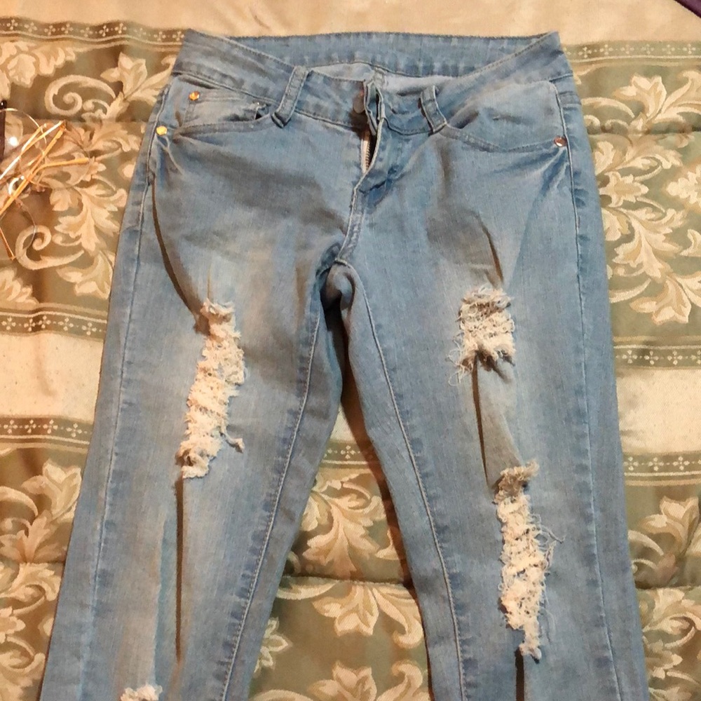 Light blue distressed skinny jeans